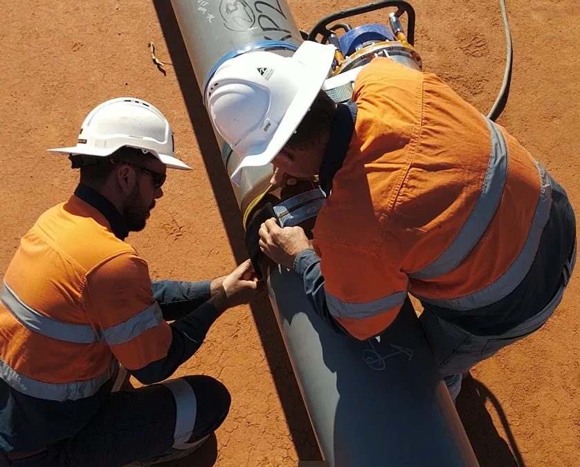 AXS technicians performing NDT on a pipeline weld